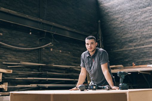 Confident young worker looking at camera